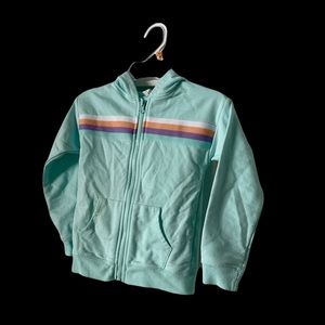 Ideology Girls zip-up hooded sweatshirt with rainbow stripe and front pockets.